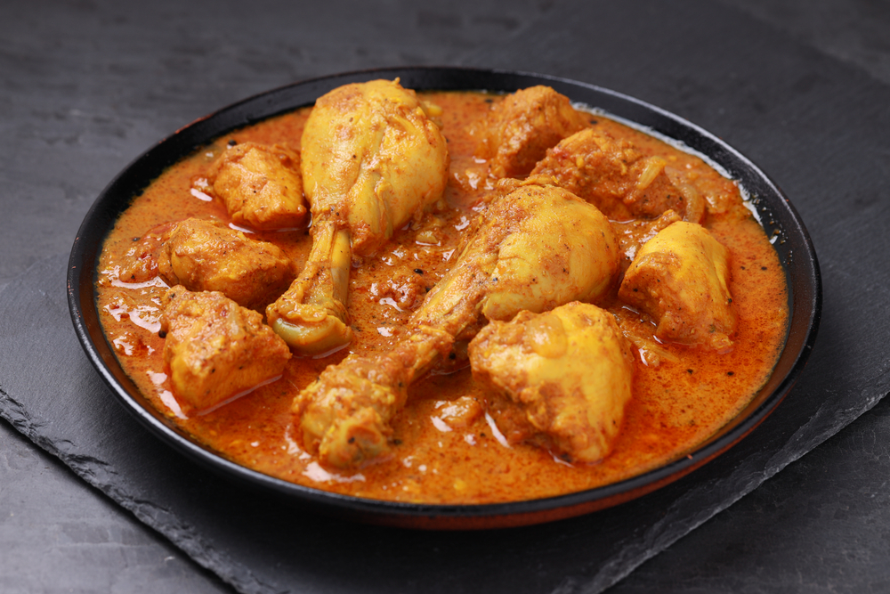 a plate of chicken curry