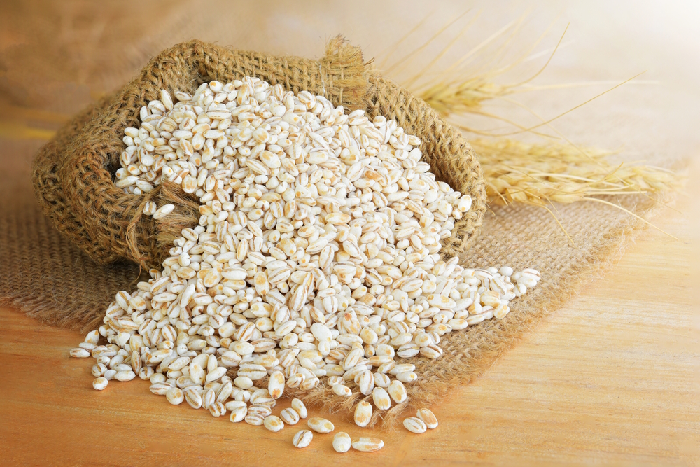 Barley-grain-in-wooden-background