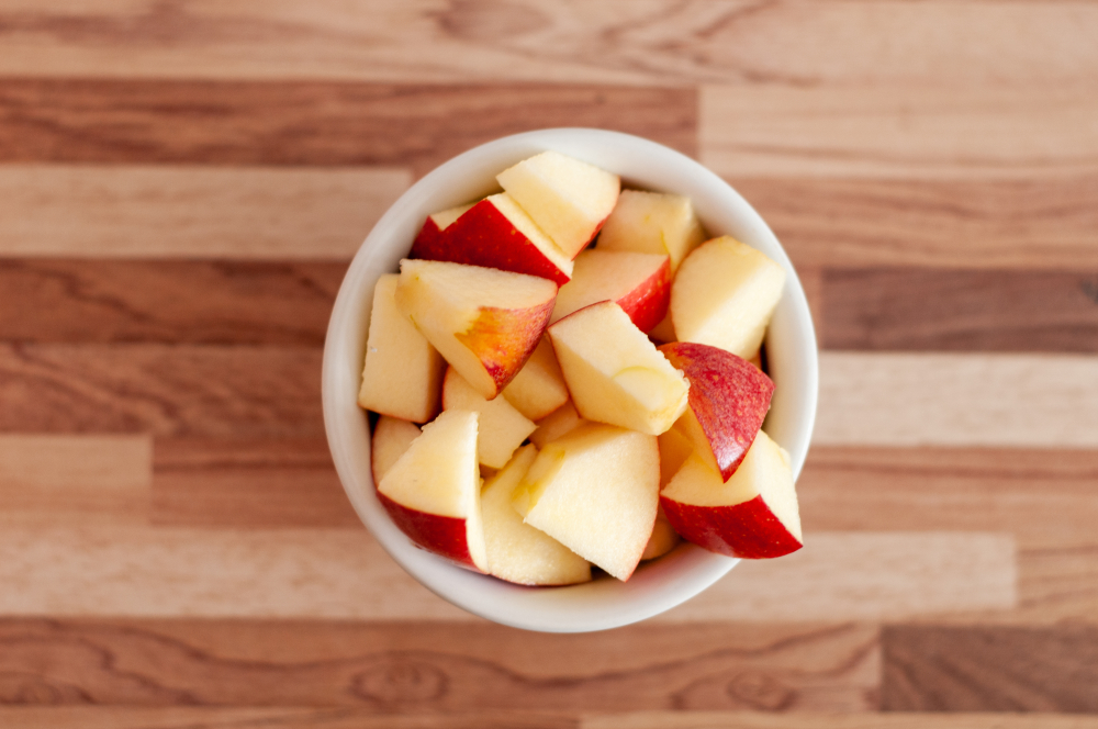 Chopped apples on wooden table