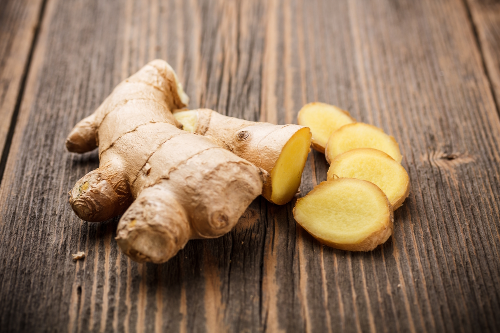 Ginger-root-sliced-on-wooden-table