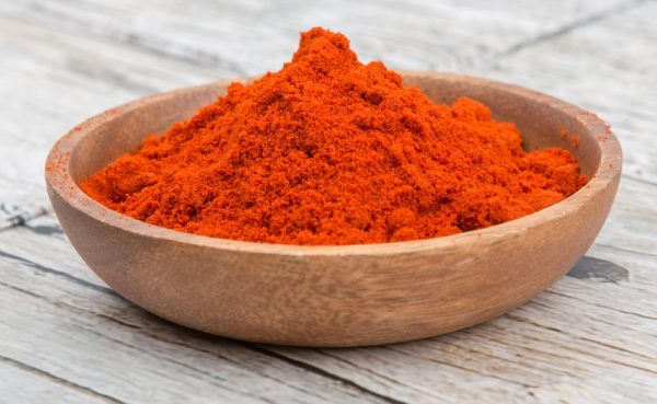 Paprika-powder-in-wooden-bowl